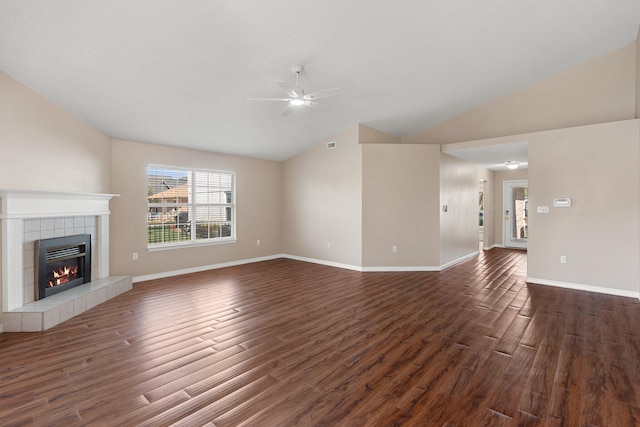 309 Wimico Cir, Destin, FL 32541 - unfurnished living room with vaulted ceiling, ceiling fan, a fireplace, dark wood finished floors, and baseboards