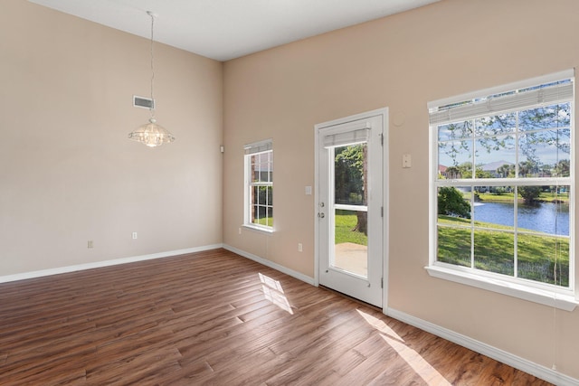 309 Wimico Cir, Destin, FL 32541 - doorway to outside featuring wood finished floors, a healthy amount of sunlight, and baseboards
