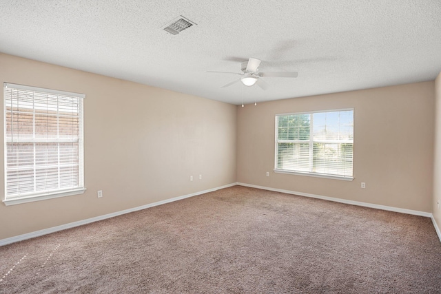309 Wimico Cir, Destin, FL 32541 - spare room with carpet floors, visible vents, a ceiling fan, and baseboards