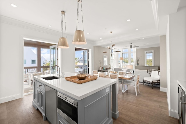 74 Town Hall Rd Unit 3B, Rosemary Beach, FL 32461 - kitchen featuring stainless steel microwave, gray cabinetry, a sink, dishwashing machine, and wood finished floors