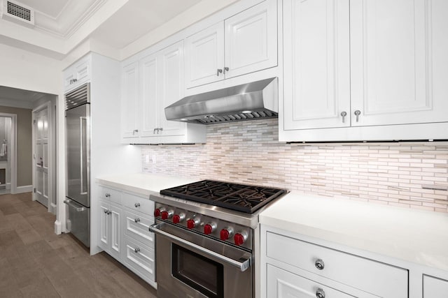 74 Town Hall Rd Unit 3B, Rosemary Beach, FL 32461 - kitchen with crown molding, light countertops, premium appliances, under cabinet range hood, and visible vents