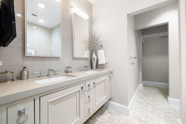 74 Town Hall Rd Unit 3B, Rosemary Beach, FL 32461 - full bathroom featuring double vanity, tasteful backsplash, baseboards, and a sink