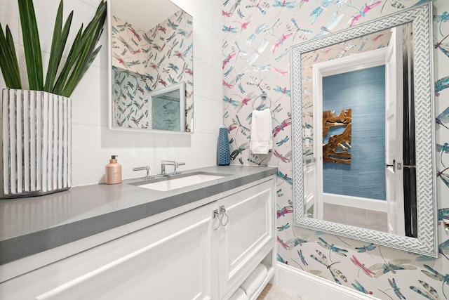 74 Town Hall Rd Unit 3B, Rosemary Beach, FL 32461 - bathroom featuring baseboards, wallpapered walls, and vanity