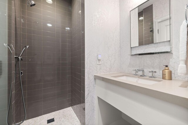 74 Town Hall Rd Unit 3B, Rosemary Beach, FL 32461 - bathroom with backsplash, tiled shower, and vanity