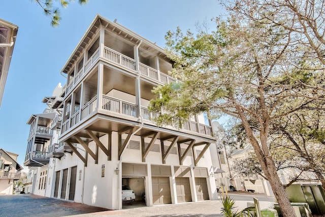 74 Town Hall Rd Unit 3B, Rosemary Beach, FL 32461 - view of building exterior with a garage