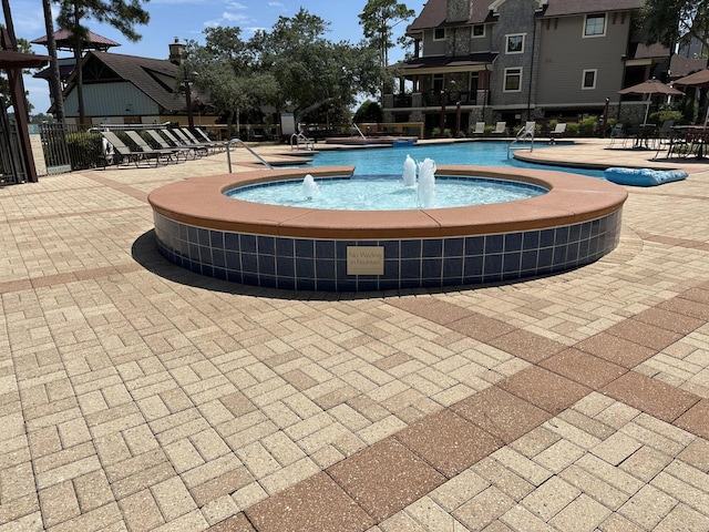 view of pool featuring a patio