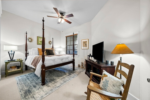 carpeted bedroom with baseboards and a ceiling fan