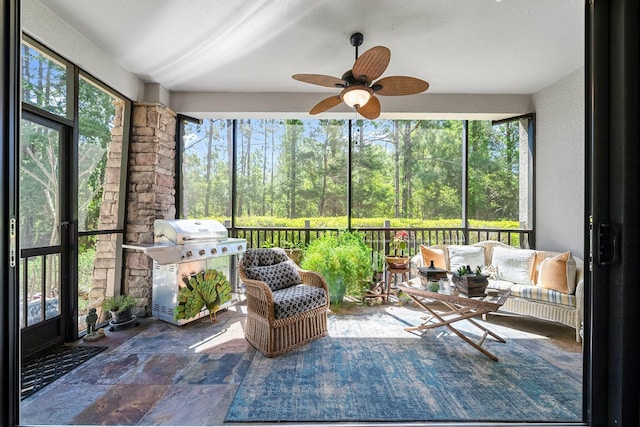 sunroom featuring an outdoor living space and ceiling fan
