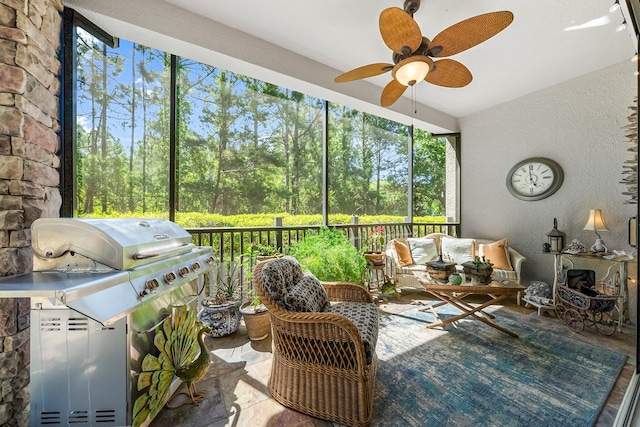 sunroom featuring area for grilling and a ceiling fan