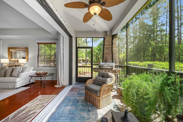 sunroom with a ceiling fan