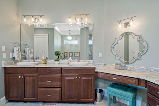 bathroom with double vanity, a sink, and an inviting chandelier
