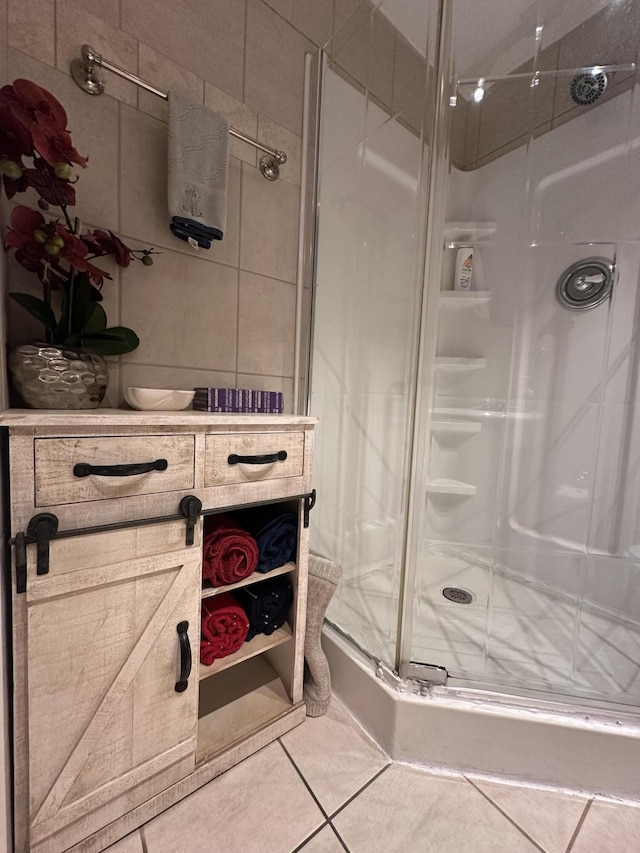 full bath with tile patterned flooring and a stall shower