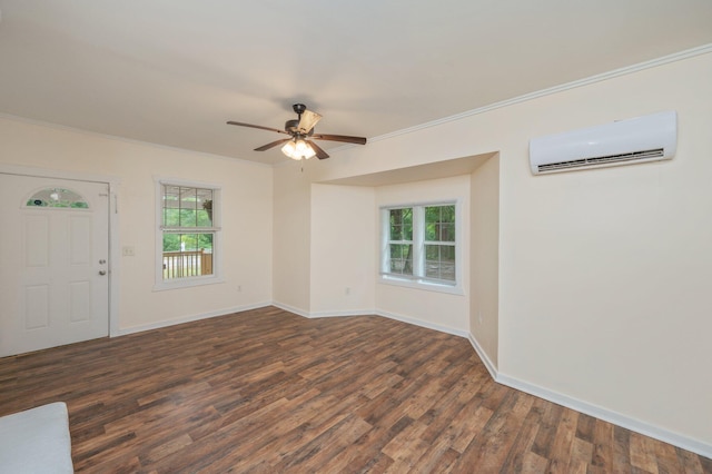 375 N Norwood Rd, Defuniak Springs, FL 32433 - entrance foyer featuring a wall unit AC, ornamental molding, dark wood-style flooring, ceiling fan, and baseboards