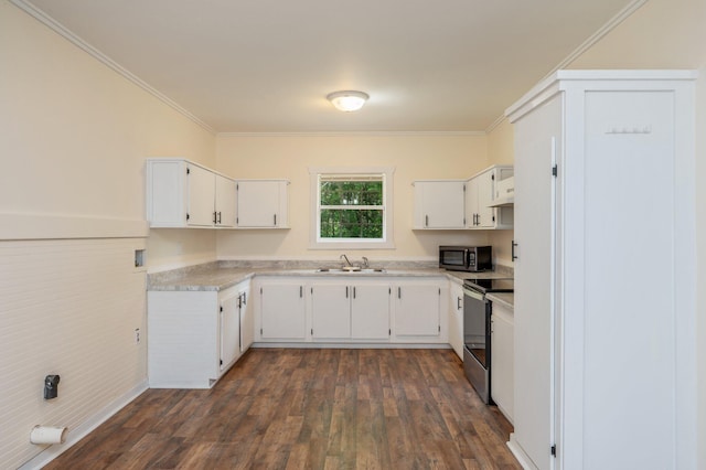 375 N Norwood Rd, Defuniak Springs, FL 32433 - kitchen featuring stainless steel range with electric cooktop, black microwave, a sink, light countertops, and dark wood finished floors