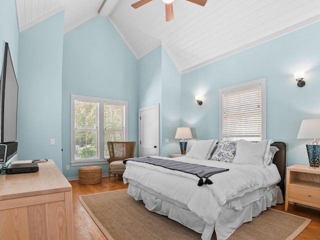 253 Salt Box Ln, Watersound, FL 32461 - bedroom with wood finished floors, beam ceiling, a ceiling fan, and high vaulted ceiling