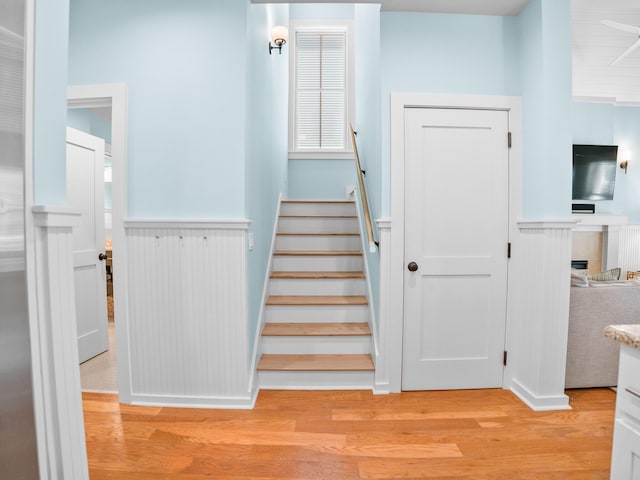 253 Salt Box Ln, Watersound, FL 32461 - stairs with wainscoting and wood finished floors