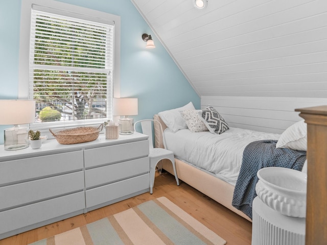 253 Salt Box Ln, Watersound, FL 32461 - bedroom with vaulted ceiling and light wood-style floors