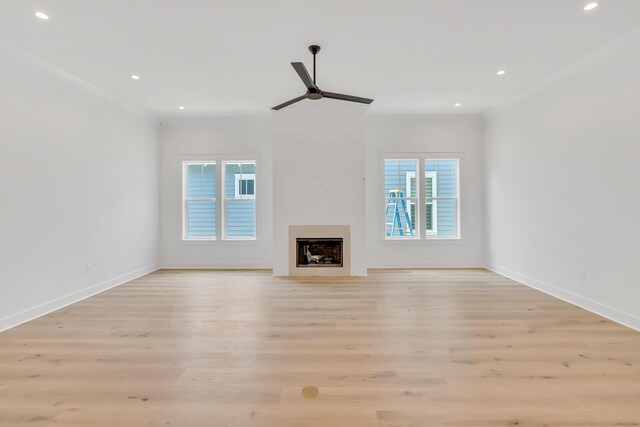 203 E Firethorn Cir Lot 24, Watersound, FL 32461 - unfurnished living room with a ceiling fan, recessed lighting, light wood-type flooring, and a fireplace