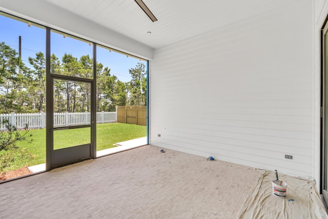 203 E Firethorn Cir Lot 24, Watersound, FL 32461 - unfurnished sunroom featuring a ceiling fan