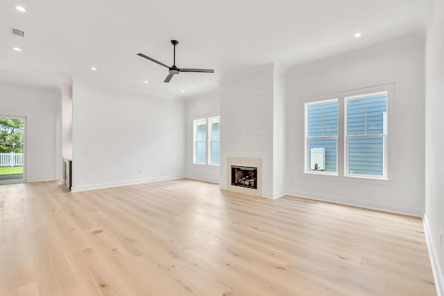 203 E Firethorn Cir Lot 24, Watersound, FL 32461 - unfurnished living room featuring a ceiling fan, a fireplace, plenty of natural light, light wood-type flooring, and recessed lighting