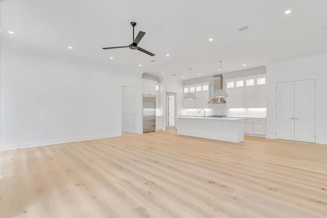 203 E Firethorn Cir Lot 24, Watersound, FL 32461 - unfurnished living room featuring light wood-type flooring, a ceiling fan, and recessed lighting