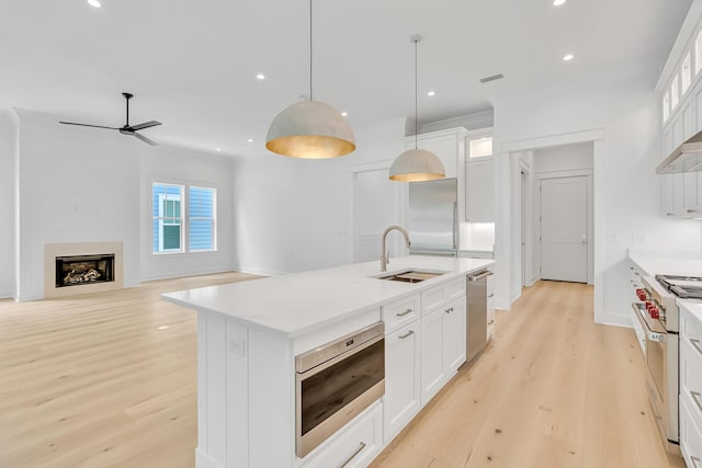 203 E Firethorn Cir Lot 24, Watersound, FL 32461 - kitchen featuring built in appliances, recessed lighting, ceiling fan, light wood-style floors, and white cabinets