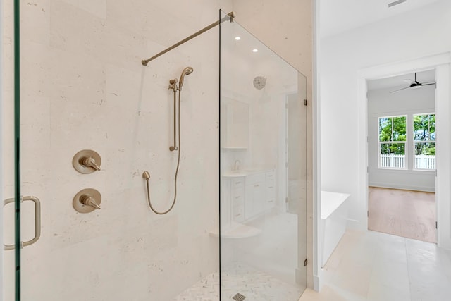 203 E Firethorn Cir Lot 24, Watersound, FL 32461 - full bathroom with a stall shower, a ceiling fan, and tile patterned flooring