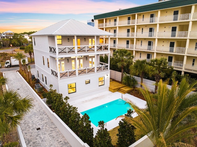 view of back of house at dusk
