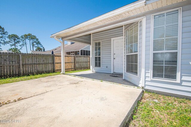 view of patio featuring fence