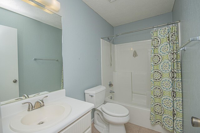 bathroom featuring a textured ceiling, toilet, tile patterned floors, vanity, and shower / bath combination with curtain