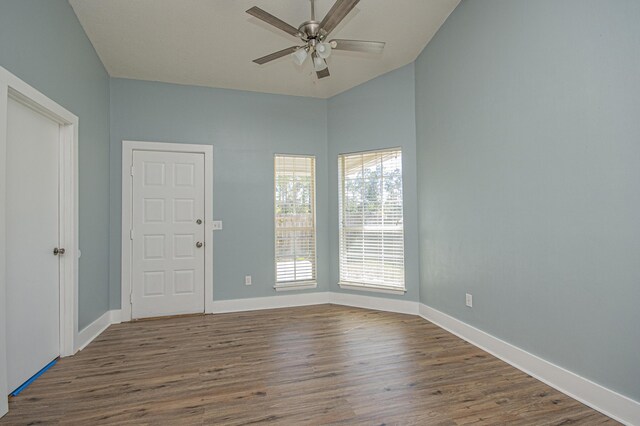 spare room with a ceiling fan, baseboards, and wood finished floors