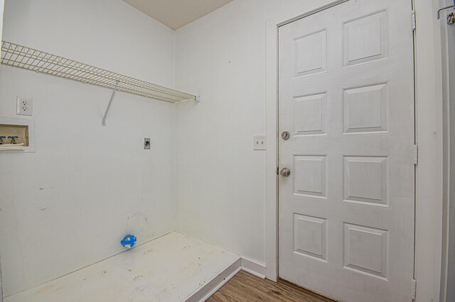 clothes washing area with washer hookup, baseboards, wood finished floors, laundry area, and electric dryer hookup