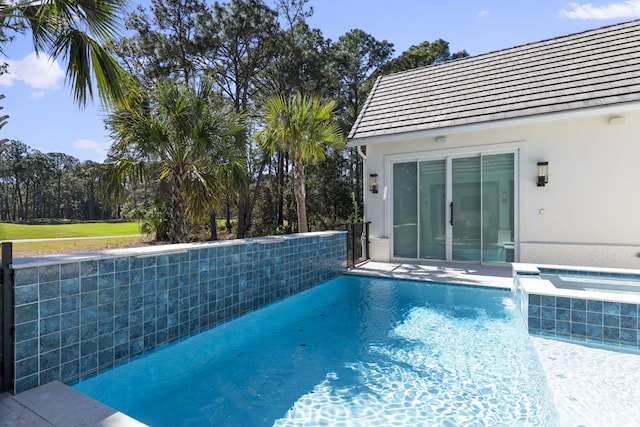 pool with an in ground hot tub