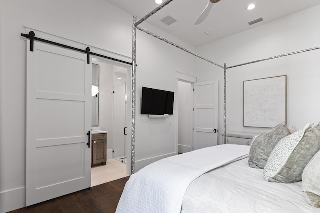 bedroom with a barn door, recessed lighting, visible vents, a ceiling fan, and dark wood-type flooring