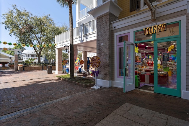 property entrance featuring brick siding