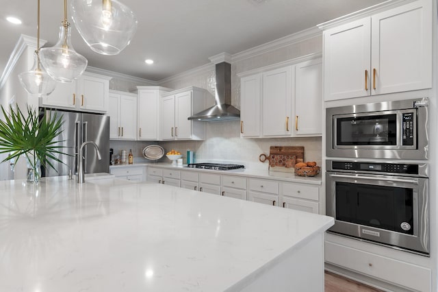 24 Palmer Ln, Santa Rosa Beach, FL 32459 - kitchen featuring a sink, wall chimney exhaust hood, stainless steel appliances, white cabinets, and decorative backsplash
