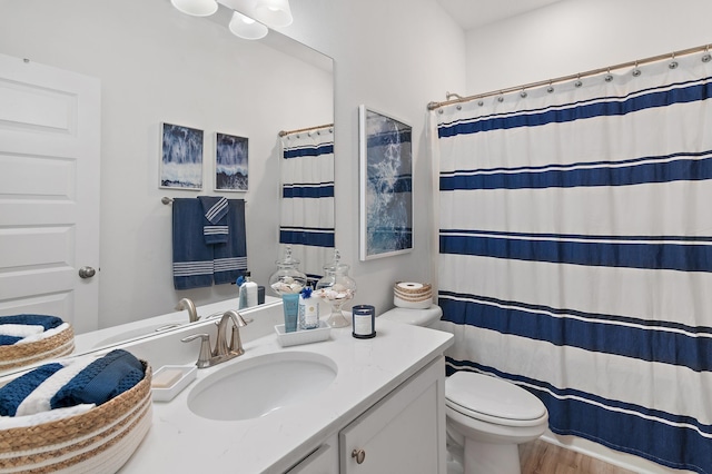 24 Palmer Ln, Santa Rosa Beach, FL 32459 - full bathroom featuring a shower with curtain, wood finished floors, toilet, and vanity