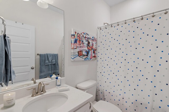 24 Palmer Ln, Santa Rosa Beach, FL 32459 - bathroom with toilet, a shower with shower curtain, and vanity