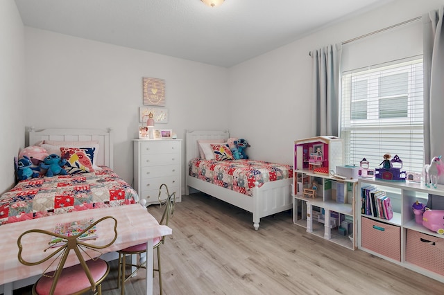 24 Palmer Ln, Santa Rosa Beach, FL 32459 - bedroom with light wood-style flooring