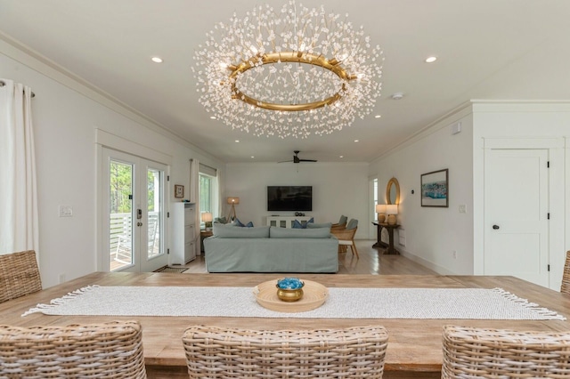 living room with ornamental molding, wood finished floors, and recessed lighting