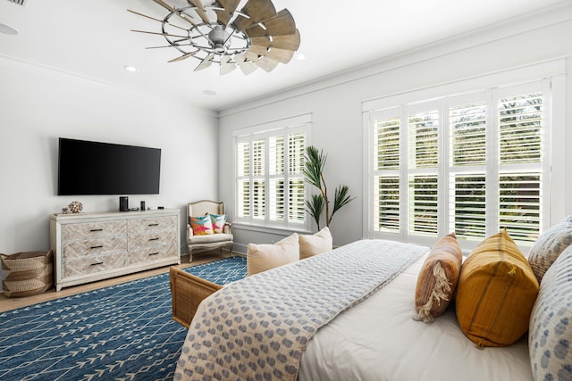 bedroom featuring wood finished floors, recessed lighting, ornamental molding, and ceiling fan