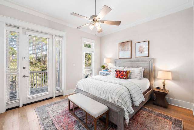 bedroom featuring baseboards, ornamental molding, light wood-type flooring, a ceiling fan, and access to outside