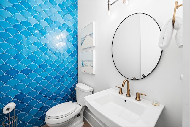 bathroom with toilet and a sink