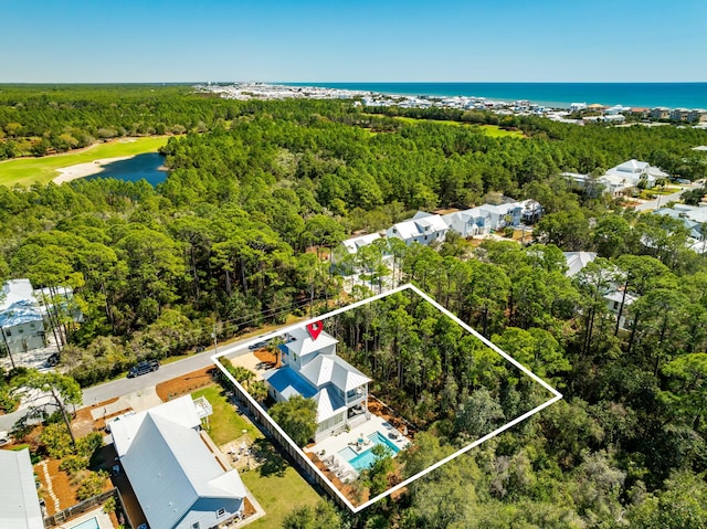 bird's eye view featuring a water view and a forest view