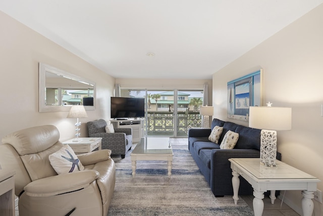 living area with tile patterned floors