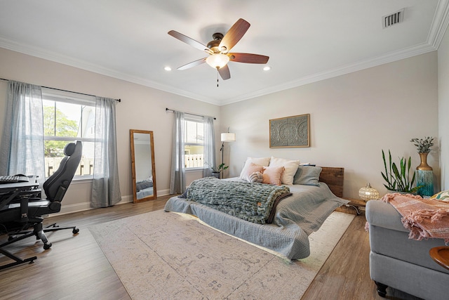 bedroom with visible vents, wood finished floors, baseboards, ornamental molding, and recessed lighting