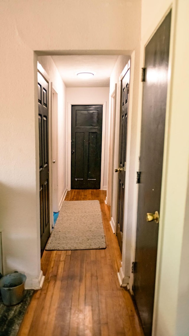 306 N 58th Ave, Pensacola, FL 32506 - corridor with baseboards and hardwood / wood-style flooring