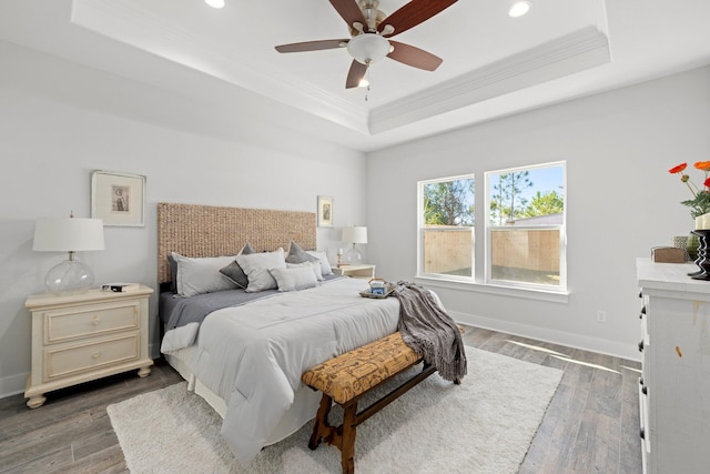 213 N Wells St, Panama City Beach, FL 32413 - bedroom with recessed lighting, ornamental molding, baseboards, a raised ceiling, and wood finished floors