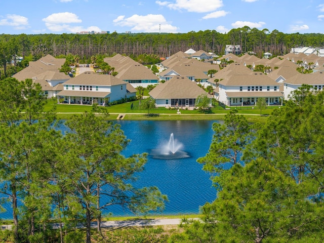 aerial view featuring a residential view and a water view
