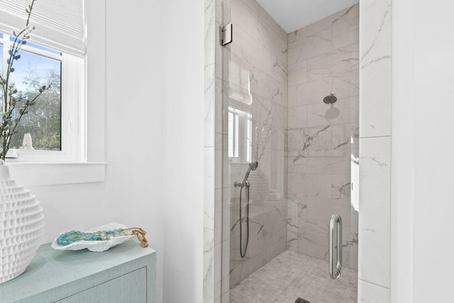 full bath with a marble finish shower